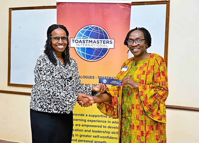 A business dialogues Toastmaster being awarded
