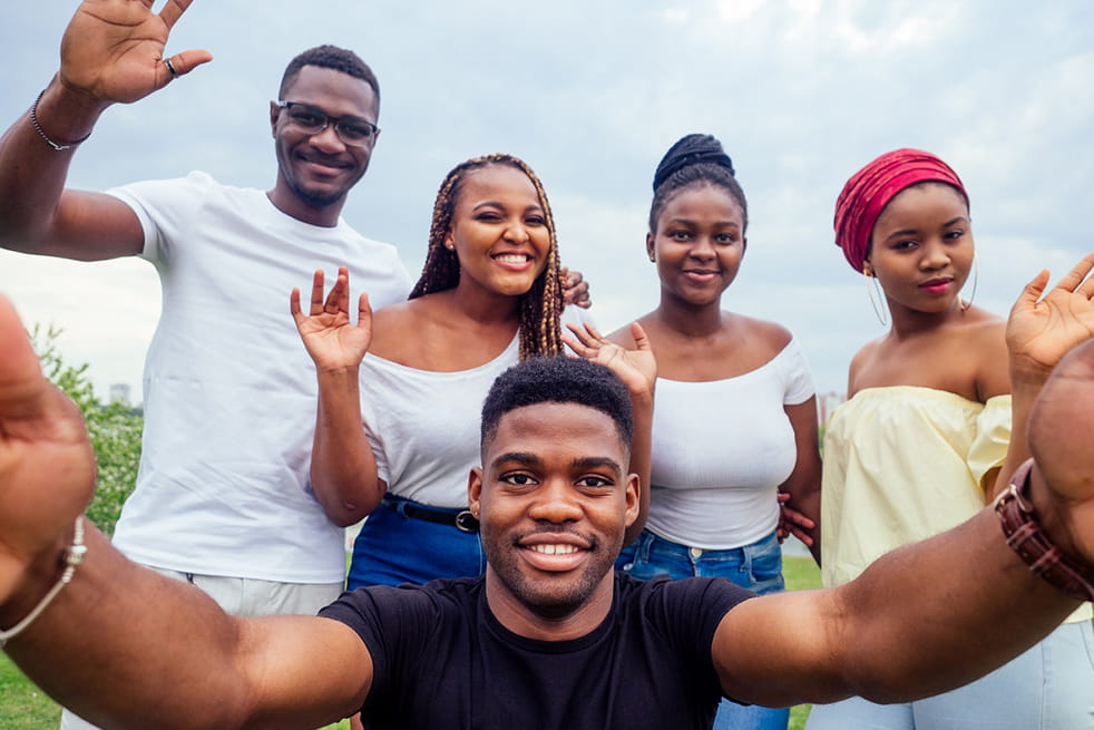 Group selfie of young black people dressed casually