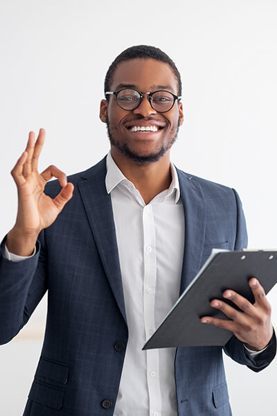 Young man smiling with OK sign