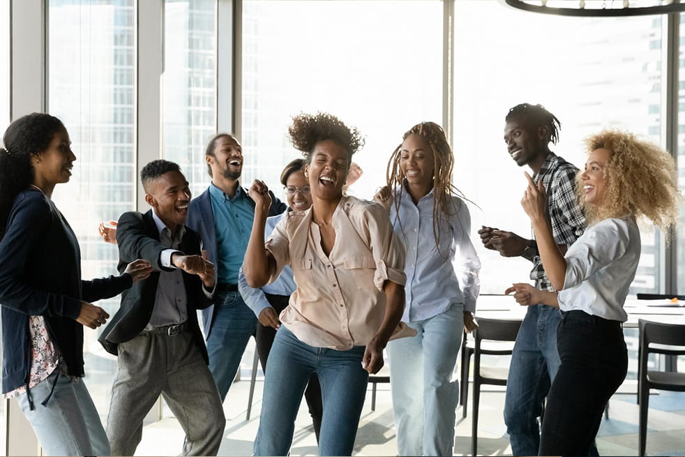 Young people in a lively dance at work